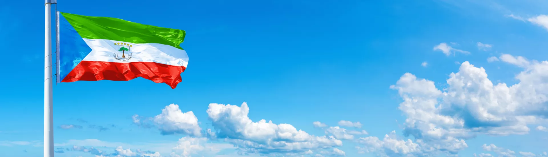 Equatorial Guinea flag on a blue sky