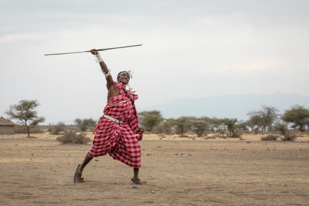 Maasai man practicing javelin throwing, Kenya