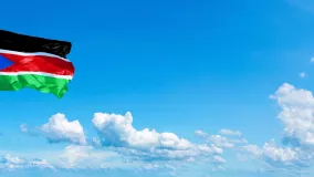Southern Sudan flag at sky view
