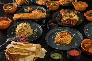 Assorted Sri Lankan dishes and papadam bread