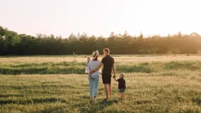 family walking in the field