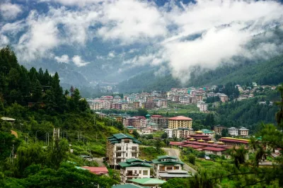 buildings and clouds in mountains